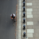 Cyclists pass a jogger along the Embankment during the morning rush hour in central London